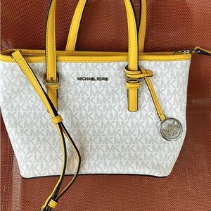 Small white and yellow Michael Kors crossbody purse